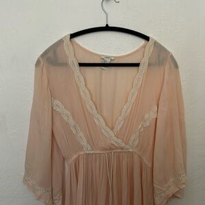 This is a blush, pink, small mini dress. It is perfect for the beach or summer!